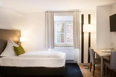 Ein Bett oder Betten in einem Zimmer der Unterkunft MO Hotel by WMM Hotels