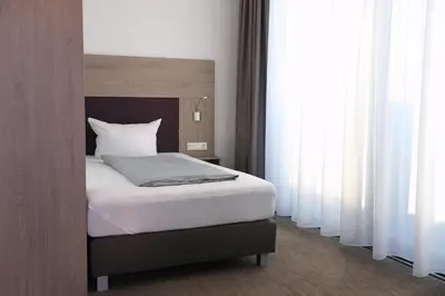 Ein Bett oder Betten in einem Zimmer der Unterkunft Hotel New In