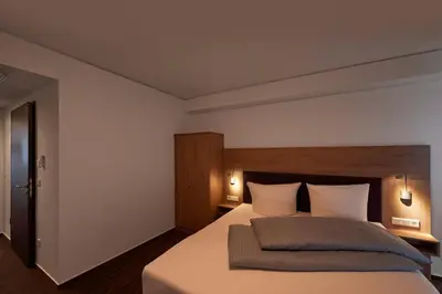 Ein Bett oder Betten in einem Zimmer der Unterkunft Hotel New In