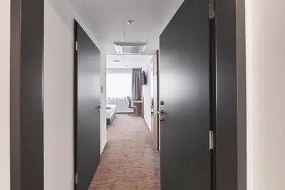 Ein Bett oder Betten in einem Zimmer der Unterkunft Hotel New In