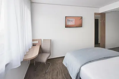 Ein Bett oder Betten in einem Zimmer der Unterkunft Hotel New In