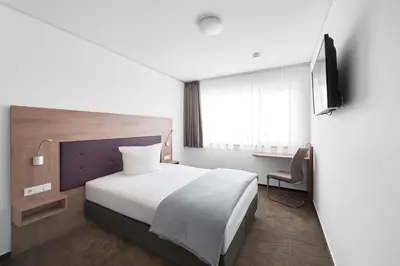 Ein Bett oder Betten in einem Zimmer der Unterkunft Hotel New In