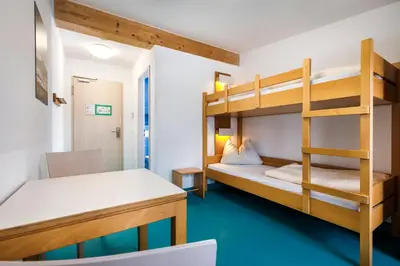 Ein Bett oder Betten in einem Zimmer der Unterkunft Jugendherberge Bad Tölz