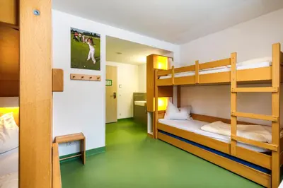 Ein Bett oder Betten in einem Zimmer der Unterkunft Jugendherberge Bad Tölz