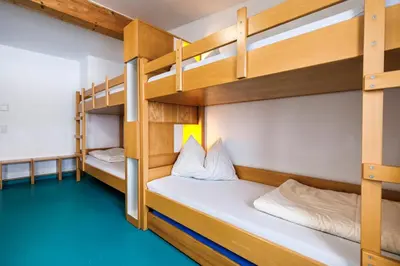 Ein Bett oder Betten in einem Zimmer der Unterkunft Jugendherberge Bad Tölz