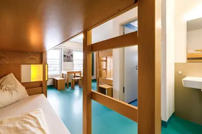 Ein Bett oder Betten in einem Zimmer der Unterkunft Jugendherberge Bad Tölz