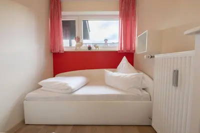 Ein Bett oder Betten in einem Zimmer der Unterkunft Alpennest