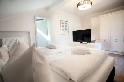 Ein Bett oder Betten in einem Zimmer der Unterkunft Olympia