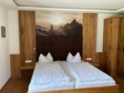 Ein Bett oder Betten in einem Zimmer der Unterkunft s´Quartier am Schliersee