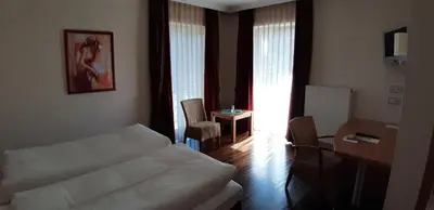 Ein Bett oder Betten in einem Zimmer der Unterkunft Hotel Rauch