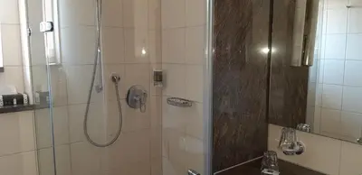 Ein Badezimmer in der Unterkunft Hotel Rauch