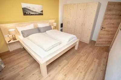 Ein Bett oder Betten in einem Zimmer der Unterkunft Ferienwohnungen 