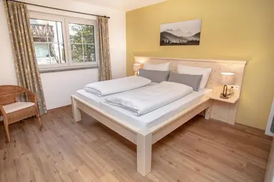 Ein Bett oder Betten in einem Zimmer der Unterkunft Ferienwohnungen 