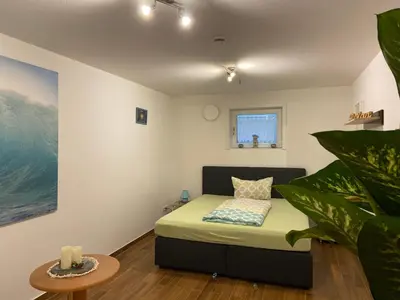 Ein Bett oder Betten in einem Zimmer der Unterkunft Anton‘s Souterrain-Wohnung