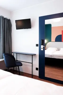 Ein Bett oder Betten in einem Zimmer der Unterkunft The Dot | 24/7 Checkin