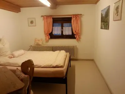 Ein Bett oder Betten in einem Zimmer der Unterkunft Ferienhaus Kraihof, Münchner Straße 234