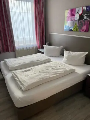 Ein Bett oder Betten in einem Zimmer der Unterkunft Pension Belo Sono