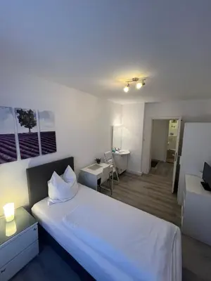 Ein Bett oder Betten in einem Zimmer der Unterkunft Pension Belo Sono