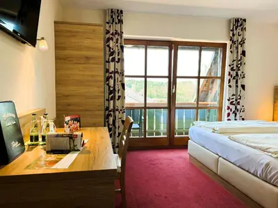 Ein Bett oder Betten in einem Zimmer der Unterkunft Gasthaus und Landhotel Wiedmann