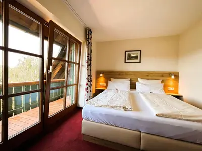 Ein Bett oder Betten in einem Zimmer der Unterkunft Gasthaus und Landhotel Wiedmann