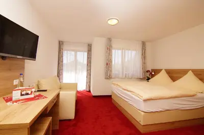 Ein Bett oder Betten in einem Zimmer der Unterkunft Gasthaus und Landhotel Wiedmann