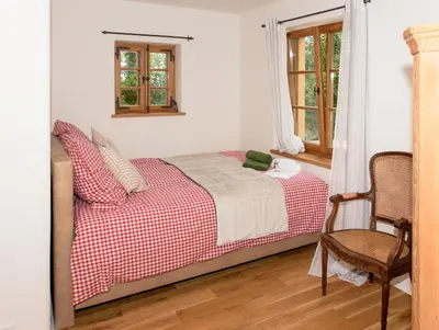 Ein Bett oder Betten in einem Zimmer der Unterkunft Chalet Landsberg
