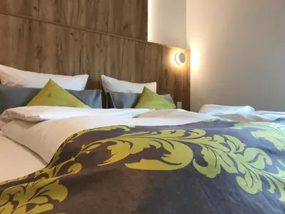Ein Bett oder Betten in einem Zimmer der Unterkunft Business Boardinghouse Augsburg, zentral, ruhig & mit Parkplatz