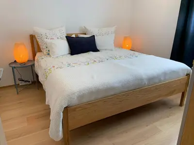 Ein Bett oder Betten in einem Zimmer der Unterkunft Ferienwohnungen Schwarzer in Seehausen am Staffelsee