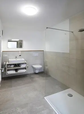 Ein Badezimmer in der Unterkunft Apartment Hotel 37