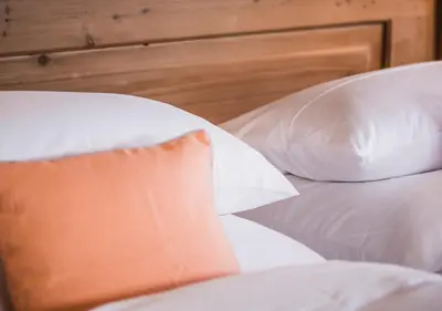Ein Bett oder Betten in einem Zimmer der Unterkunft Berghotel Altes Wallberghaus