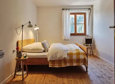 Ein Bett oder Betten in einem Zimmer der Unterkunft Berghotel Altes Wallberghaus