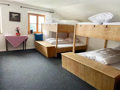 Ein Bett oder Betten in einem Zimmer der Unterkunft Berghotel Altes Wallberghaus