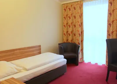 Ein Bett oder Betten in einem Zimmer der Unterkunft Come IN Hotel