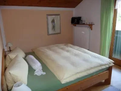 Ein Bett oder Betten in einem Zimmer der Unterkunft Mondscheinwinkl