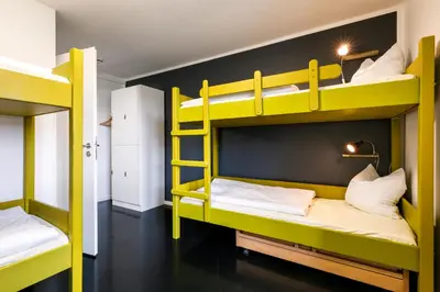 Ein Bett oder Betten in einem Zimmer der Unterkunft Jugendherberge Lenggries