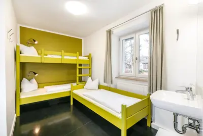 Ein Bett oder Betten in einem Zimmer der Unterkunft Jugendherberge Lenggries