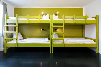 Ein Bett oder Betten in einem Zimmer der Unterkunft Jugendherberge Lenggries