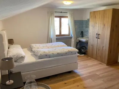 Ein Bett oder Betten in einem Zimmer der Unterkunft Ferienwohnung Heilingbrunner