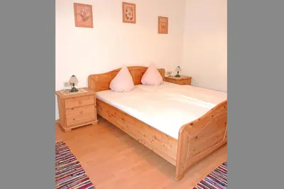 Ein Bett oder Betten in einem Zimmer der Unterkunft Ferienwohnungen Maurer Höhenberg