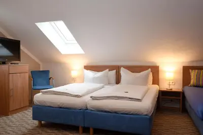 Ein Bett oder Betten in einem Zimmer der Unterkunft Hotel Hecht Garni
