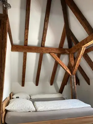 Ein Bett oder Betten in einem Zimmer der Unterkunft Pension Zur Alten Post