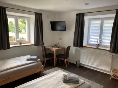 Ein Bett oder Betten in einem Zimmer der Unterkunft Pension Zur Alten Post