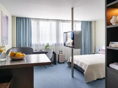 Ein Bett oder Betten in einem Zimmer der Unterkunft Numa Munich Viktoria