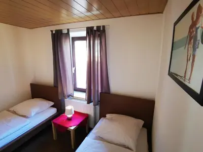 Ein Bett oder Betten in einem Zimmer der Unterkunft Stadtdomizil