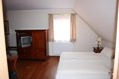 Ein Bett oder Betten in einem Zimmer der Unterkunft Landgasthof Haagen