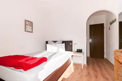Ein Bett oder Betten in einem Zimmer der Unterkunft Hotel Effland -Sauna -Pool