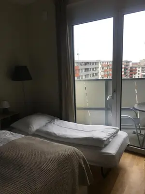Ein Bett oder Betten in einem Zimmer der Unterkunft Premium Apartment München Messe