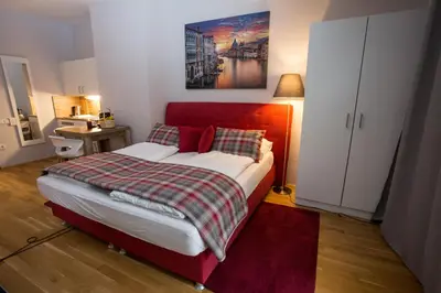 Ein Bett oder Betten in einem Zimmer der Unterkunft Premium Apartment München Messe
