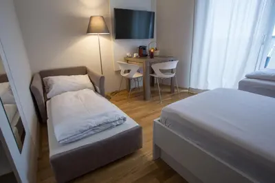 Ein Bett oder Betten in einem Zimmer der Unterkunft Premium Apartment München Messe