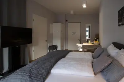 Ein Bett oder Betten in einem Zimmer der Unterkunft Premium Apartment München Messe